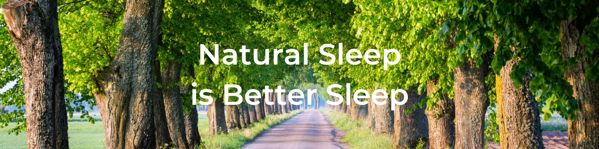 Natural Sleep is Better Sleep in white font overlaying a scenic pathway lined by large tree